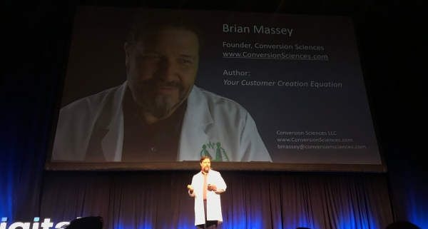 Brian Massey on Stage at Digital Summit Denver in Lab Coat